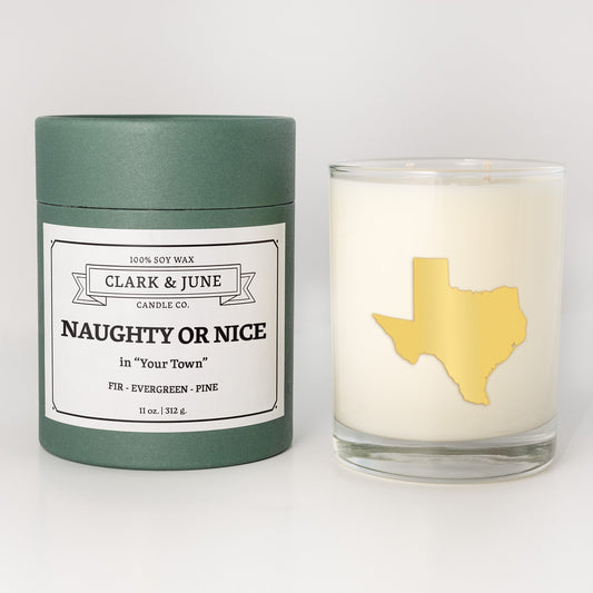 Double wicked soy candle in a 13.5 oz tumbler with the state of Texasprinted in 22k gold foil on the face. Green cylinder packaging with Naughty or Nice in "Your Town" on the label. SEO Text – Drinking glass, soy wax candle, Christmas Candle, hand poured, small batch, scented candle, Woman Owned, local candle, Housewarming present, gives back, charity, community candle, becomes a cocktail glass, closing gift. 