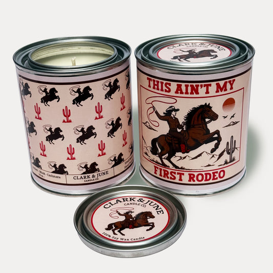14oz Cowgirl Rodeo design soy wax candle in a pint sized paint can made by Clark & June Candle Co. The candle is wrapped with a brown and tan label with cowgirls and cacti in a repeating pattern on the back and a lasso wielding cowgirl on a horse with the phrase “This ain’t my first rodeo” on the front. The scent is Amber – Musk - Cashmere and was hand poured in small batches. 

Scented Candle, Paint Can Candle. Single Cotton Wick, Western, Rodeo Core
