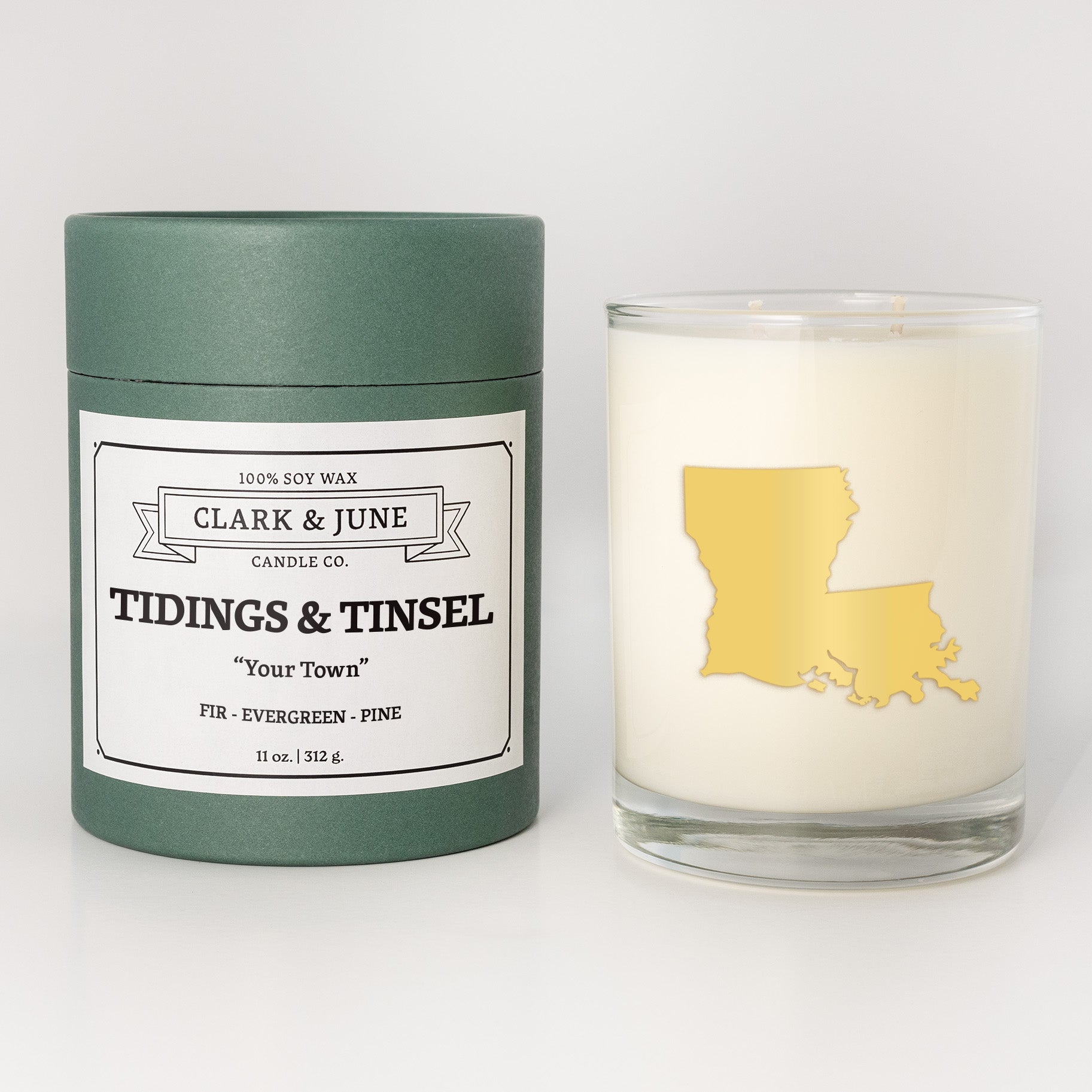 Double wicked soy candle in a 13.5 oz tumbler with the state of   Louisiana printed in 22k gold foil on the face. Green cylinder packaging with Tidings & Tinsel in "Your Town" on the label. SEO Text â€“ Drinking glass, soy wax candle, Christmas Candle, hand poured, small batch, scented candle, Woman Owned, local candle, Housewarming present, gives back, charity, community candle, becomes a cocktail glass, closing gift. 
