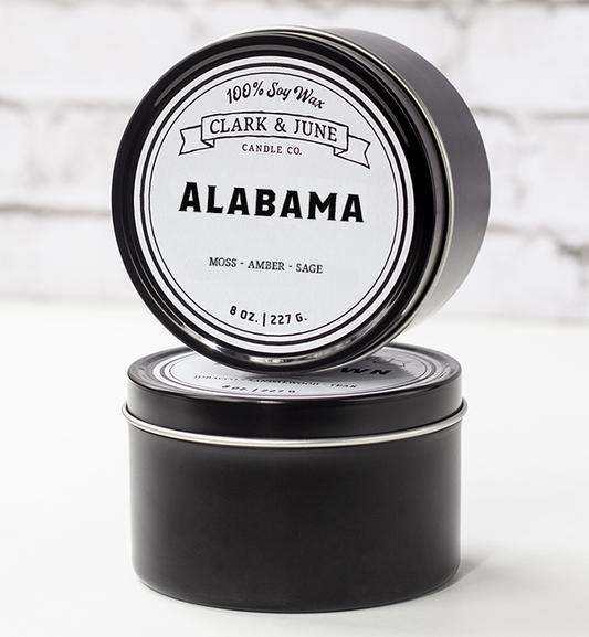 Single wicked 8oz candle in a black finish with “Alabama” on the label. SEO Text –soy wax candle, Alabama candle, hand poured, small batch, scented candle, Woman Owned, local candle, Housewarming present, gives back, charity, community candle, closing gift. 