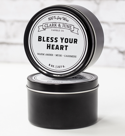 Single wicked 8oz candle in a black finish with “Bless Your Heart” on the label. SEO Text –soy wax candle, Alabama candle, hand poured, small batch, scented candle, Woman Owned, local candle, Housewarming present, gives back, charity, community candle, closing gift. 
