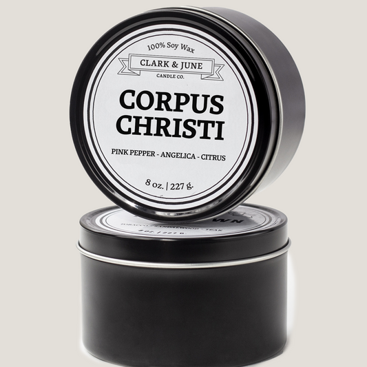 Single wicked 8oz candle in a black finish with Corpus Christi  on the label. SEO Text –soy wax candle, Texas candle, hand poured, small batch, scented candle, Woman Owned, local candle, Housewarming present, gives back, charity, community candle, closing gift. 
