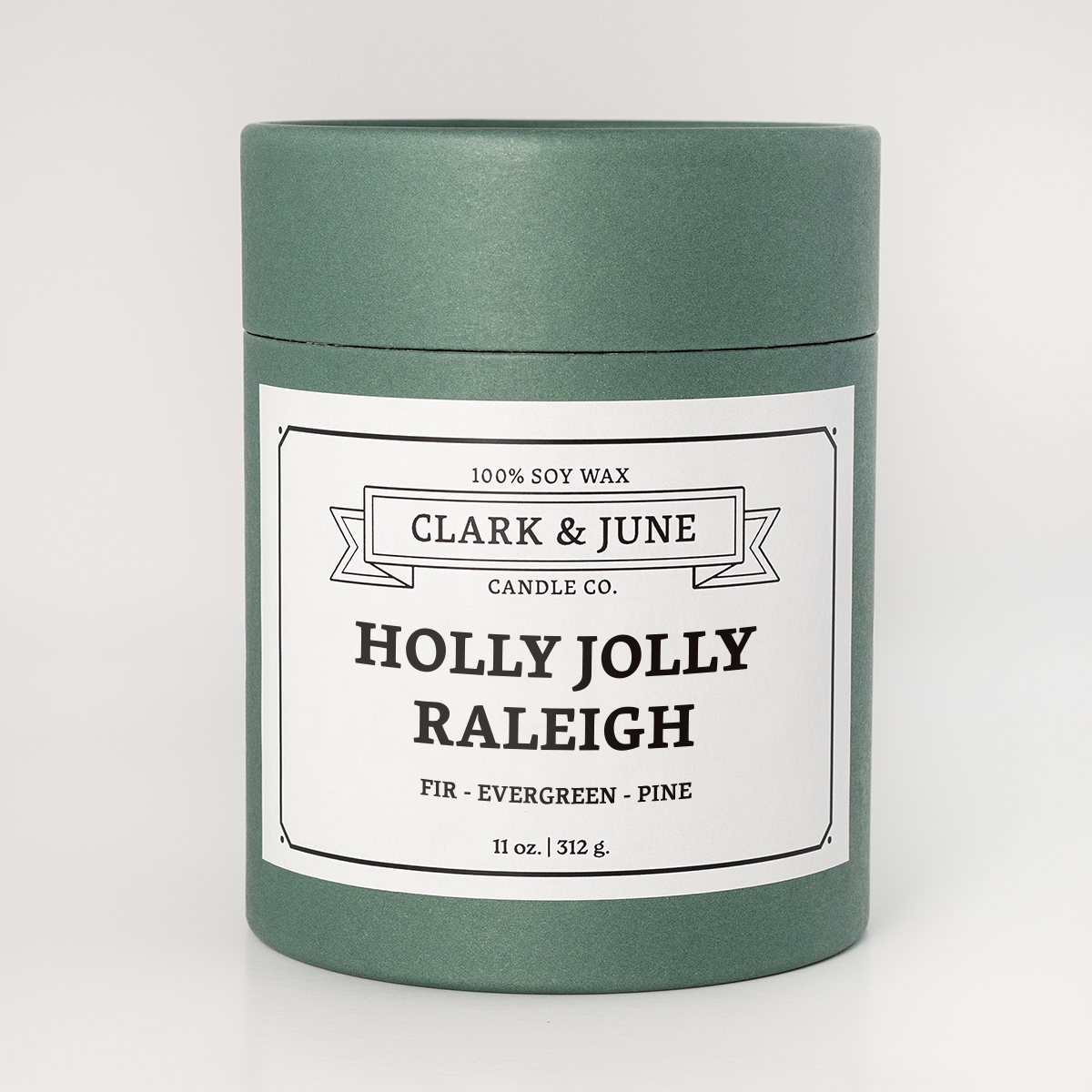 Green Candle Tube packagingwith Holly Jolly Raleigh on the label