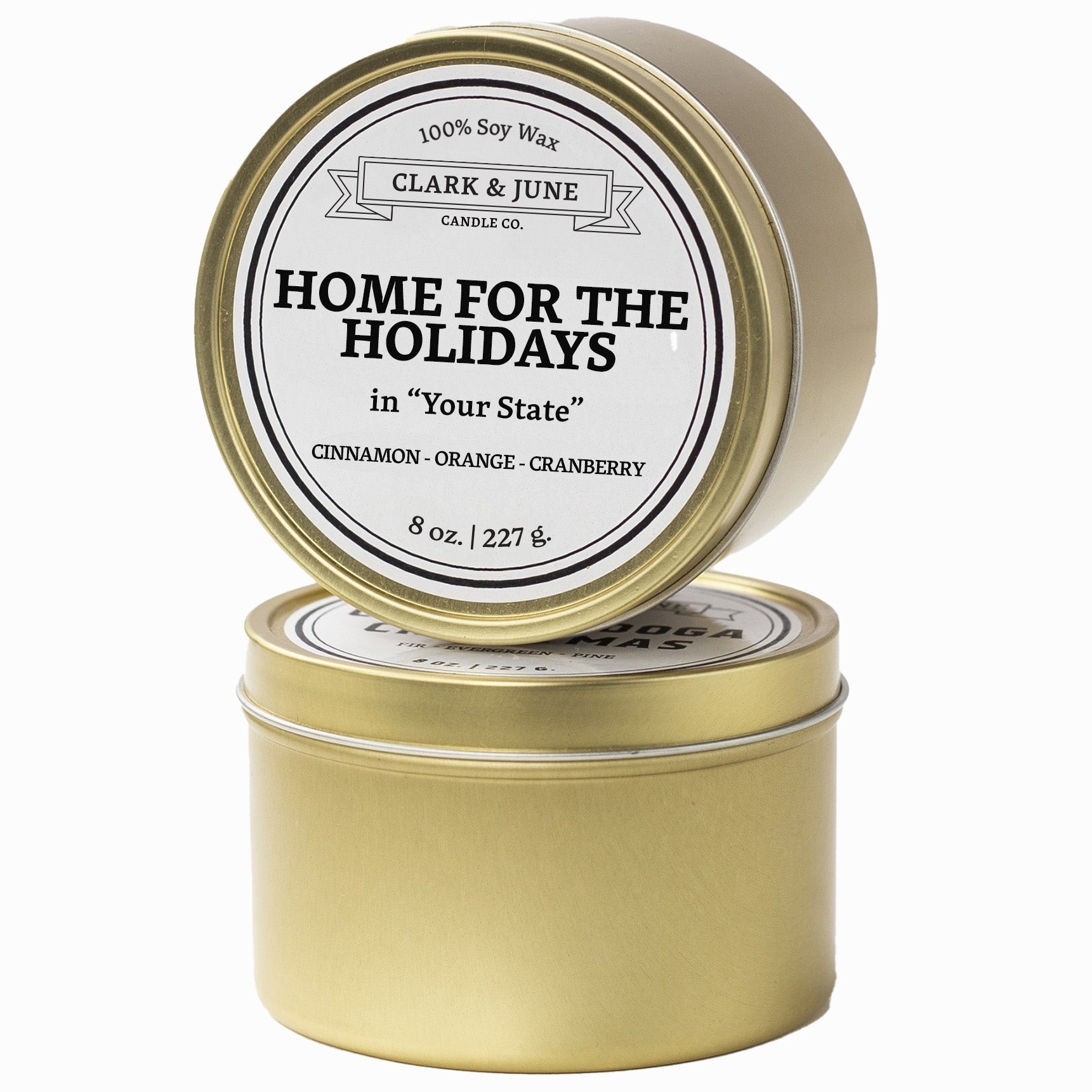Single wicked Cinnamon - Orange - Cranberry  scented 8oz candle in gold finish with Home for the Holidays in "Your State" on the label. SEO Text –soy wax candle, Christmas candle, Holiday candle hand poured, small batch, scented candle, Woman Owned, local candle, Housewarming present, gives back, charity, community candle, Soy wax candle Christmas gift.

